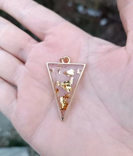 Symbol źeny se zlatavými odlesky